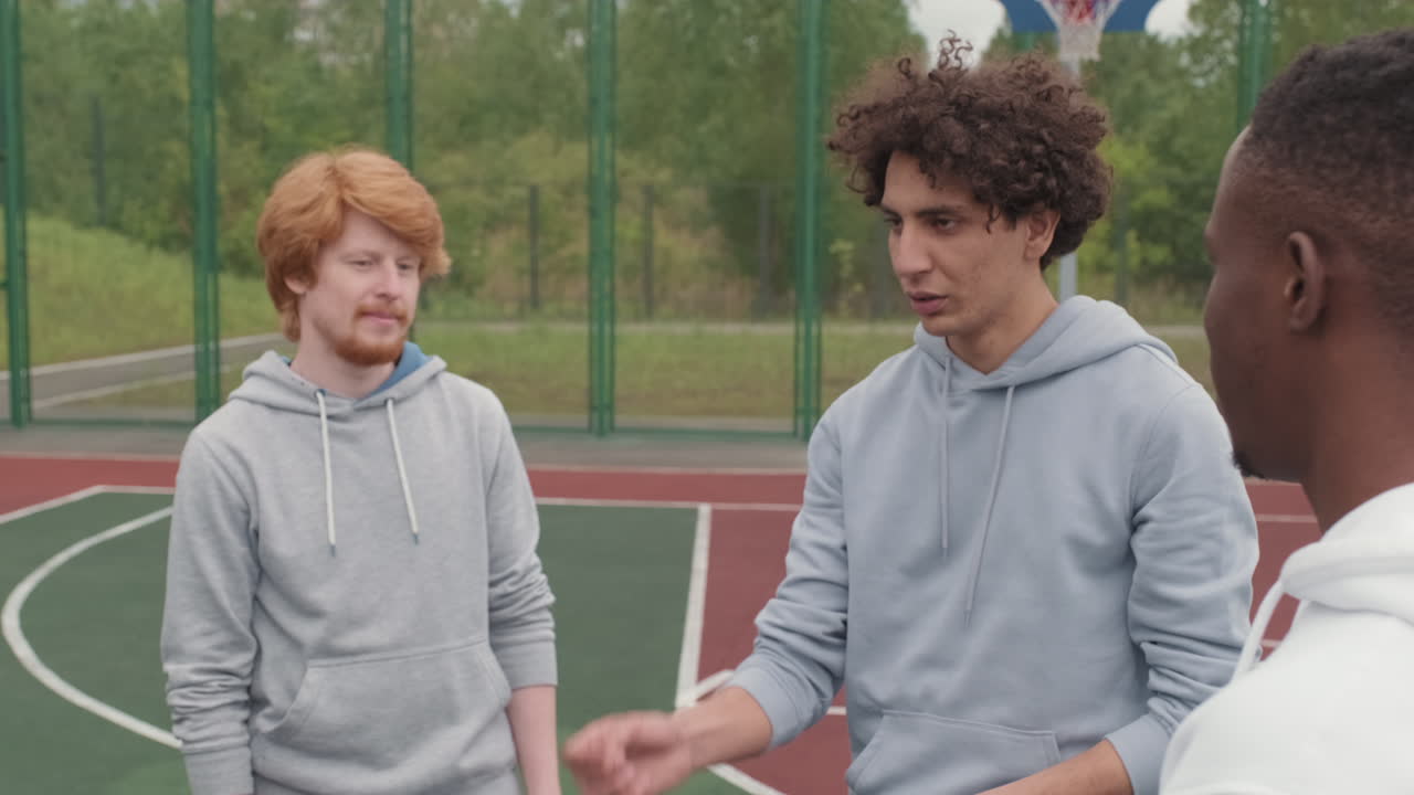 Group of Young Men on a Basketball Court