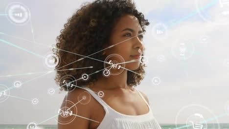 Animation-of-network-of-connections-over-woman-on-the-beach