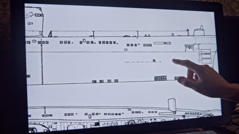 technical drawing of submarine on touch screen computer