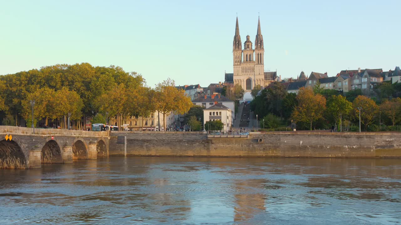 Panorma view of Verdun Bridge over Saone river and a church at background during daytime in Angers, France.