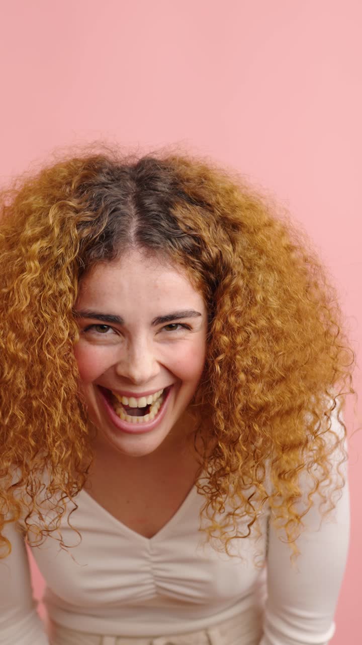 Young redhead woman showing different happy facial expressions