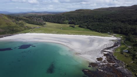 stunning white sand beach and blue sea at calgary bay on isle of mull inner hebrides scotland aerial drone footage 4k hd fly over