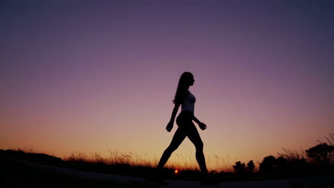 woman walking at sunset