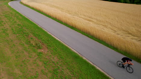 Aerial-of-cyclist-race-on-a-rural-road-at-daytime-in-summer