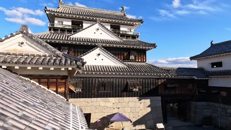 view from the castle towers ont the yard an roofs of matsuyama castle, shikoku, ehime, japan