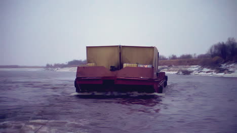 barge on a river in winter