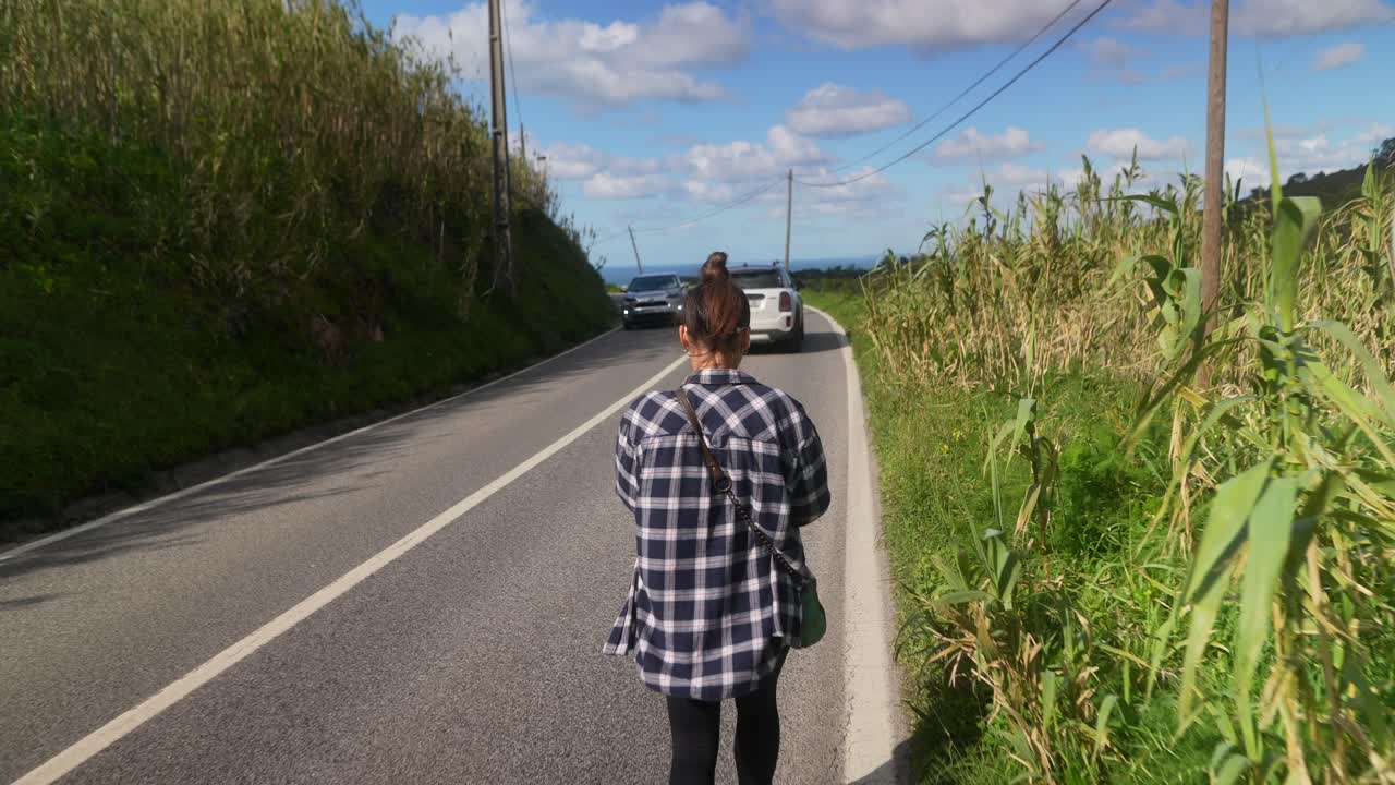 Woman Walking on Country Road