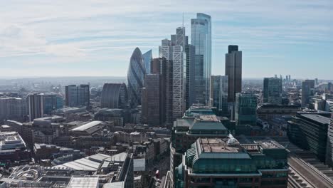 stationary-Aerial-drone-shot-City-of-London-business-district-skyscrapers-sunny-day