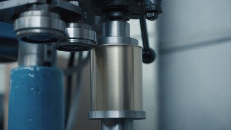 closeup of rolling cans in production