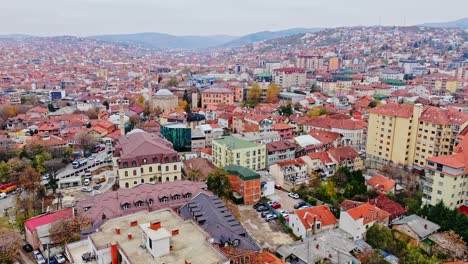 charming old-town rooftops in pristina kosovo glow under soft autumn daylight