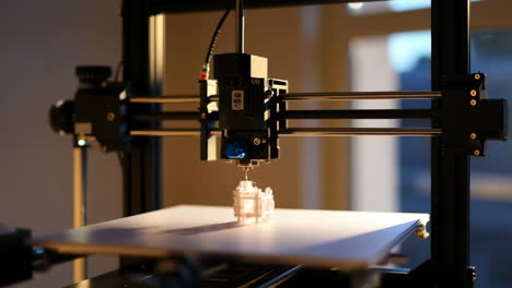 a 3d printer actively manufacturing an object