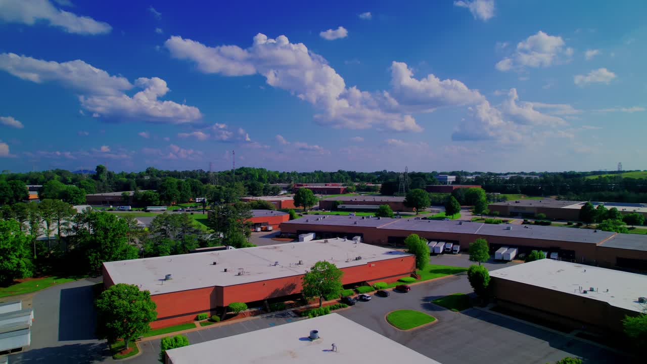 Norcross, Georgia commercial zone, detailing the suburban layout of industrial buildings, office spaces, and landscaped green areas.