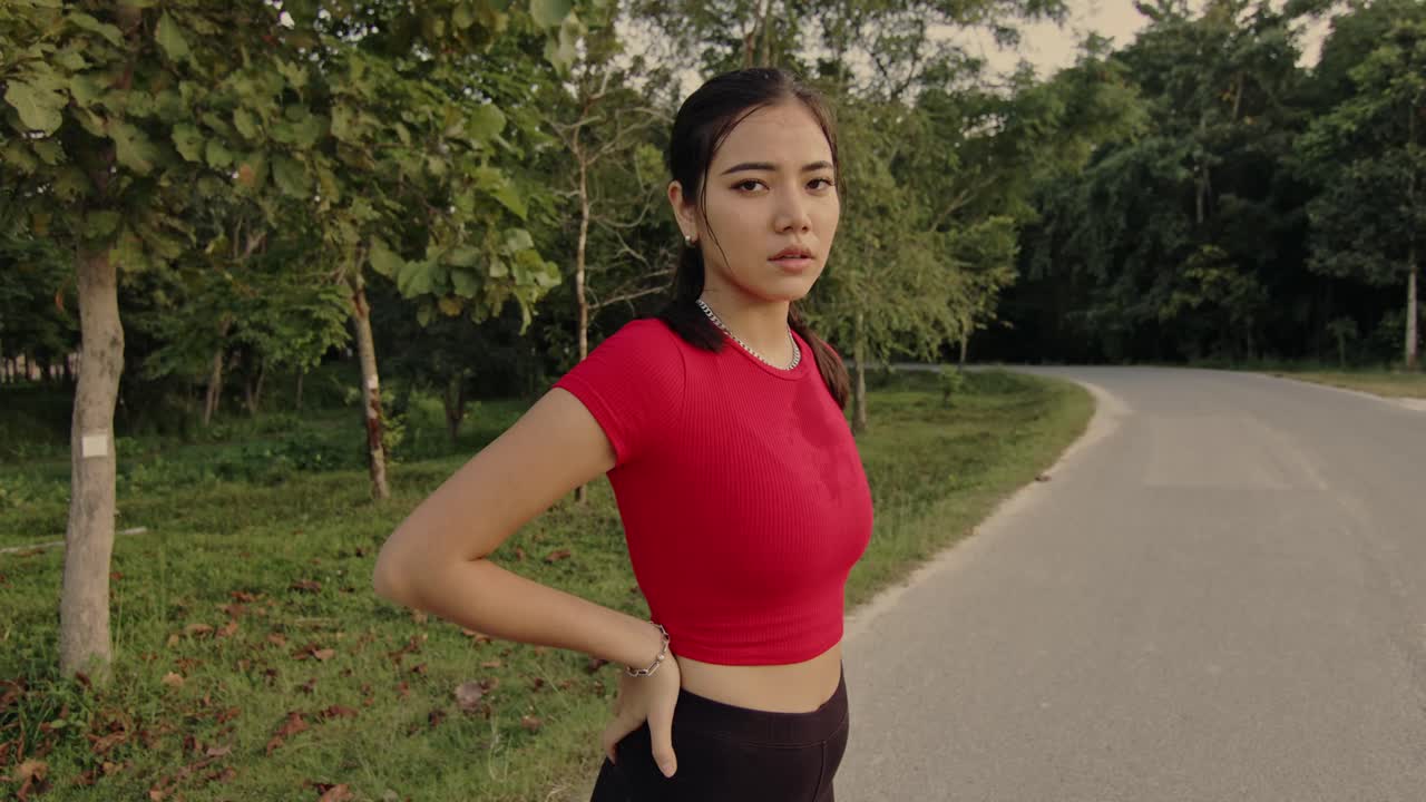 Woman taking a break after running in a forest