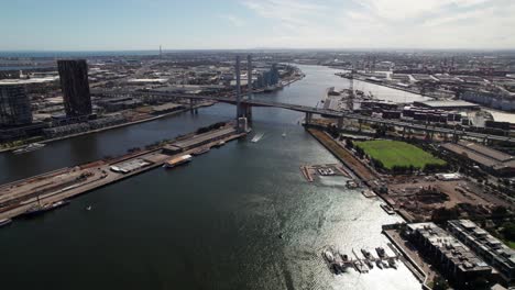 bolte bridge in docklands, melbourne, 4k aerial