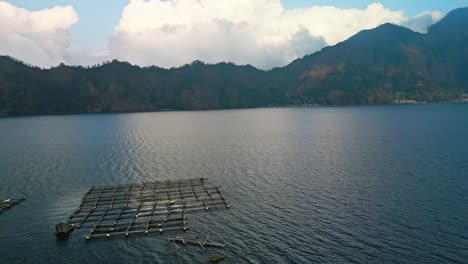 fish farms of kintamani float like delicate lacework upon the tranquil water