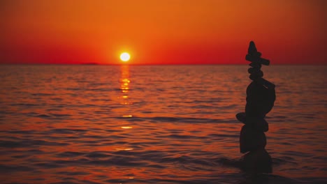 the sun is setting over the horizon at a beach at the croatian mediterranean seaside