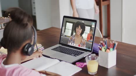 Composition-of-african-american-schoolgirl-on-laptop-online-learning-and-african-american-schoolgirl