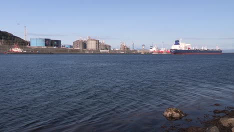 long shot of oil and gas terminal near stavanger with tanker, norway