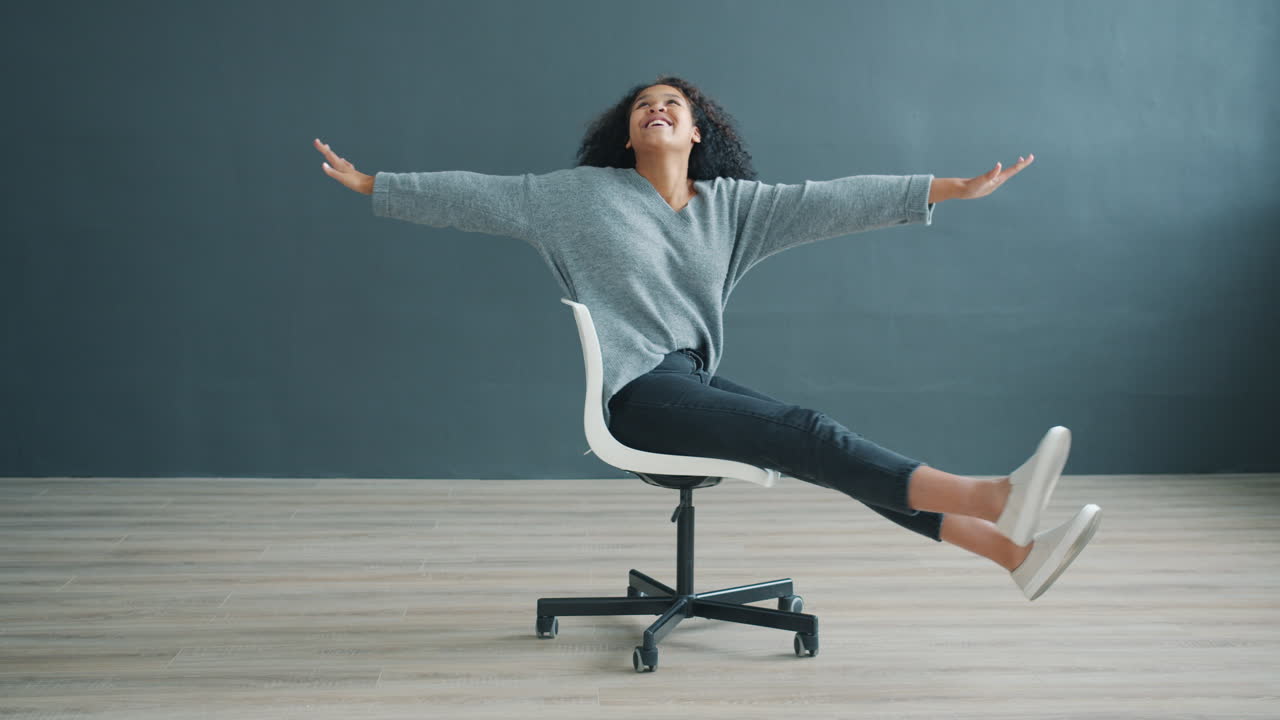 Woman sitting in a chair and smiling