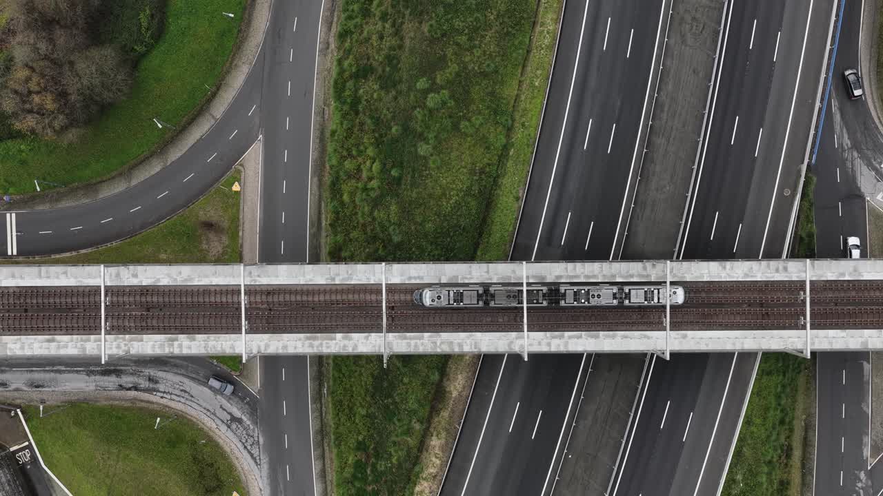 Eletrical subway riding on the tracks. Sustainable public transportation. Top down view