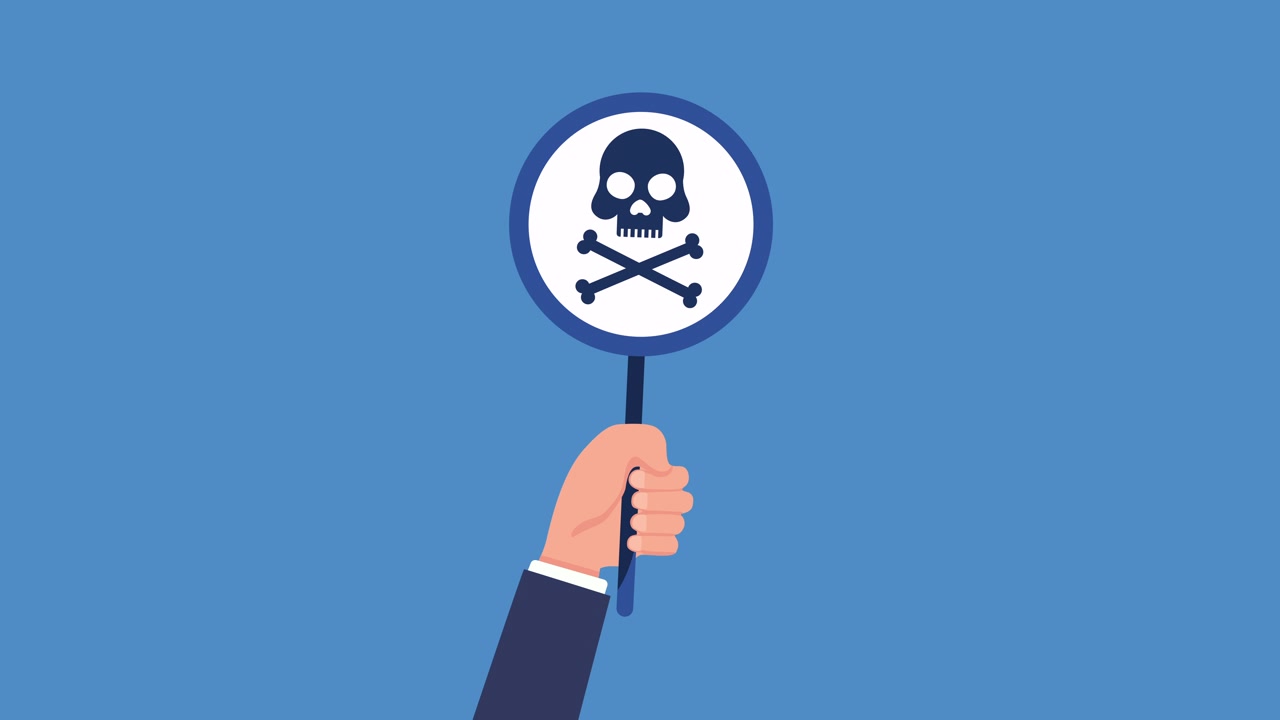 Hand Holding a Sign with a Skull and Crossbones Symbol