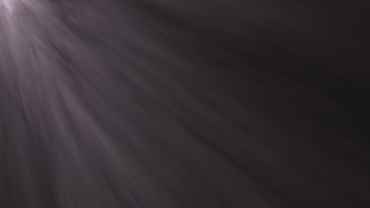 Soft White Light Rays Shining Through Dark Background