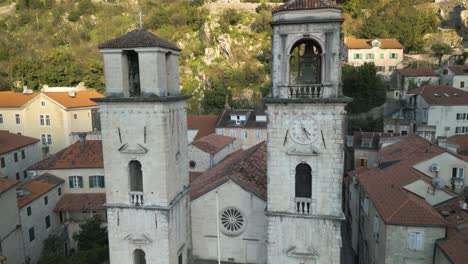 backwards drone dolley shot between the church towers of the st tryphon cathedral in kotor