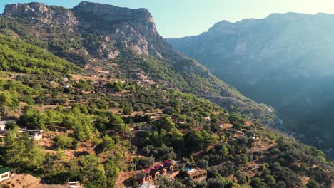 aerial view of houses in the mountain in a sunny day - turkey