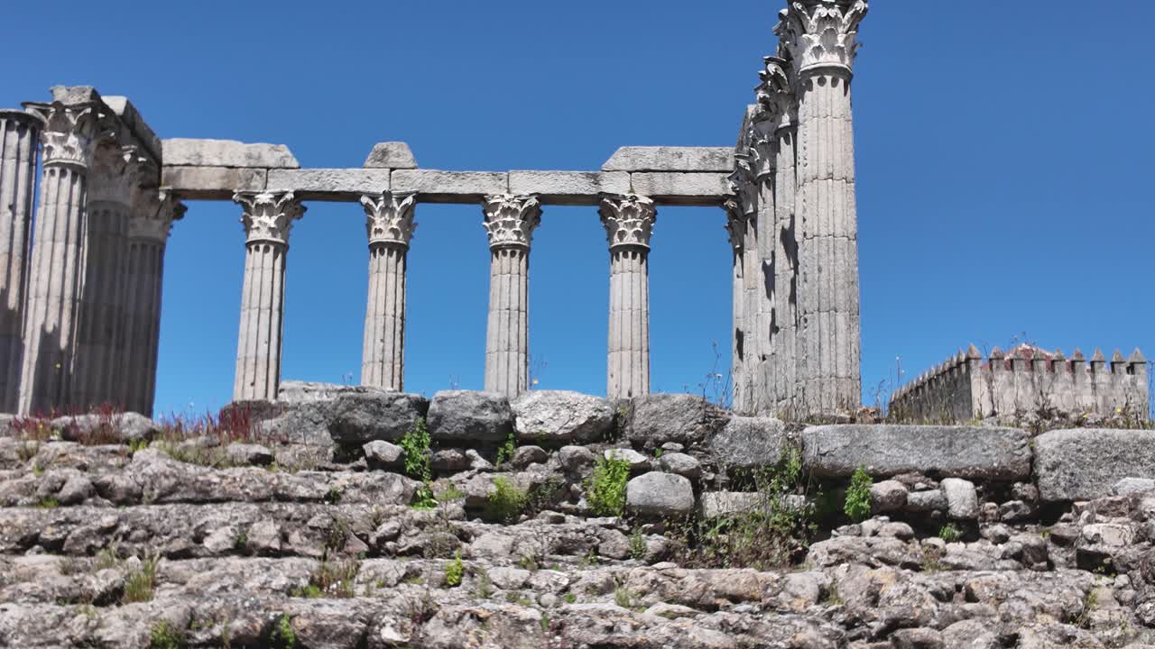 Historical Roman temple ruins located in Évora, featuring impressive ancient architecture. Pan Left