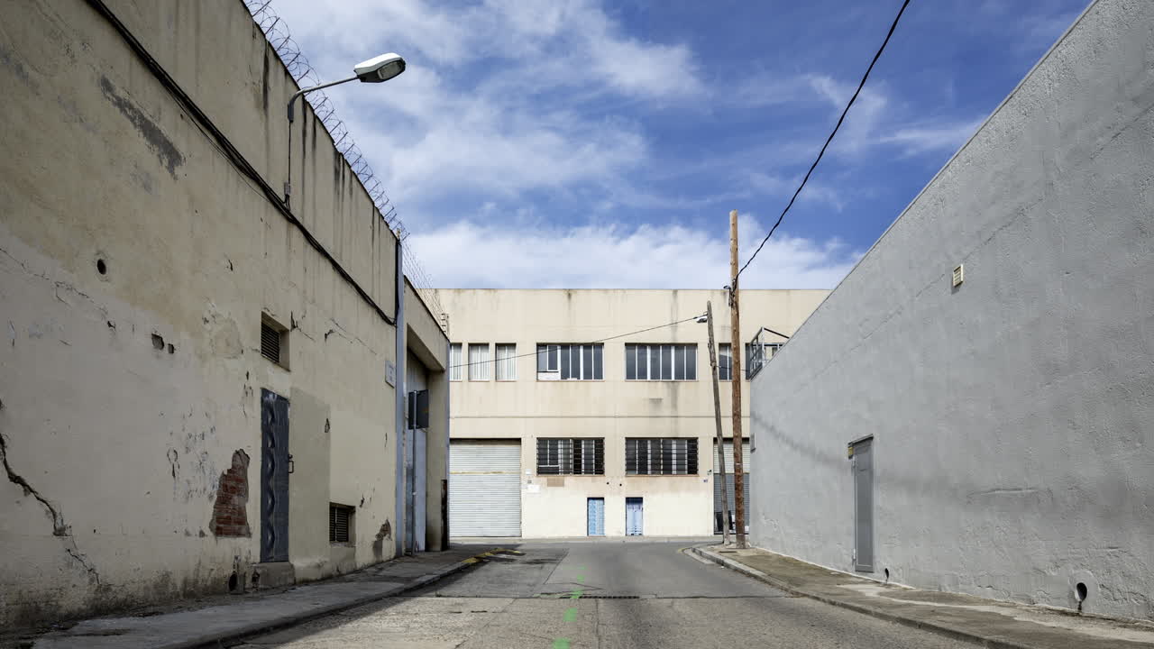 Old factory and industrial complex with passing clouds in vertical