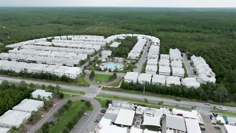 slow-spin-motion-to-left-of-Prominence-on-30A-houses-with-road-on-front-and-cross-street