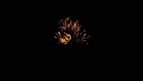 loop footage fireworks with sparkling lights and stars, ignites an explosion on a black background