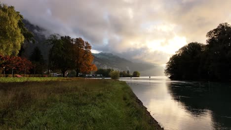 drone slowly advancing over lake walensee, capturing a breathtaking image of water reflecting the surrounding landscape.