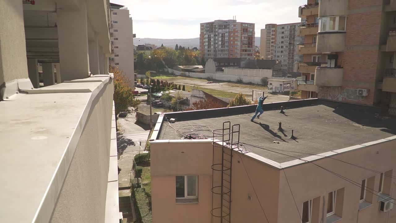 A skilled parkour athlete executes a daring front flip while leaping between two urban buildings. Capturing the essence of extreme sports and high-stakes movement.