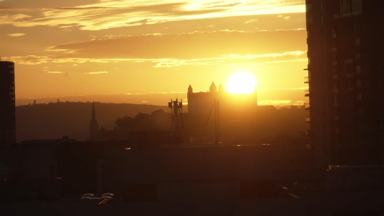 Bratislava castle telephoto shot handheld in evening with sun just over walls