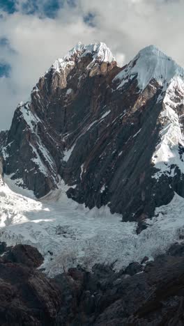 vertical 4k timelapse, clouds formations above glacier and andes mountain peaks