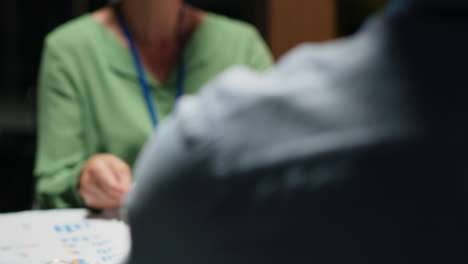 close up of diverse staff collaborating on data forecasting and analysis