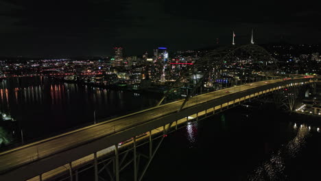portland oregon aerial v112 flyover willamette river and fremont bridge towards pearl district along nw 10th avenue capturing lively downtown cityscape at night - shot with mavic 3 cine - august 2022