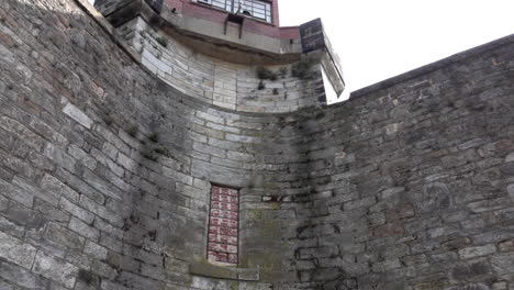 prison wall with guard post at top