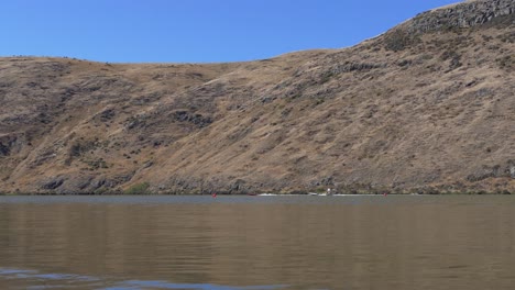 Power-boats-turn-slowly-around-buoys-before-increasing-speed-as-race-starts---Lake-Forsyth