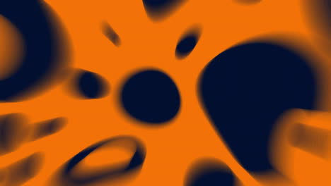 abstract animation with black irregular shapes over orange background