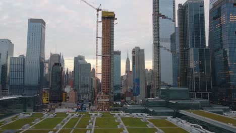 Aerial-drone-view-of-a-tall-building-under-construction-in-Hudson-Yards,-NYC