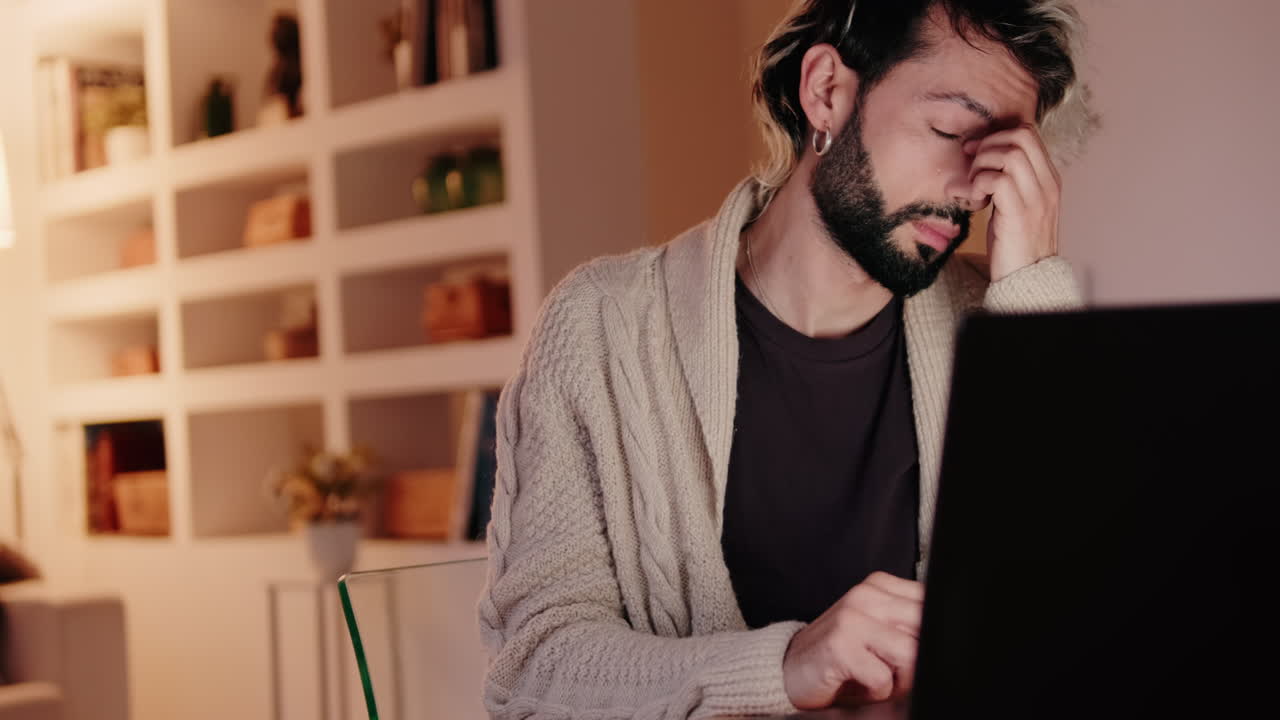 Gay Couple Working From Home on Laptop