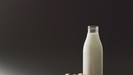 video of biscuits with chocolate and milk on dark background