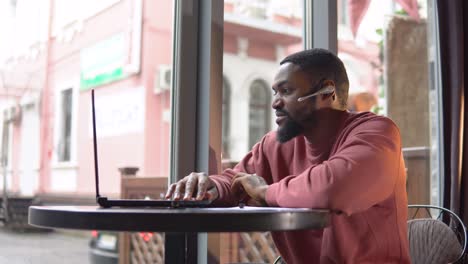 man having busines conversation by the cellphone in the restaurant