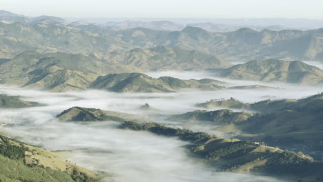 valley fog covering sao bento do sapucai village in brazil mountains