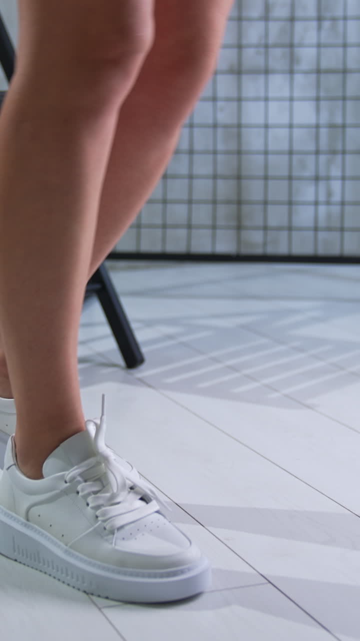 White Platform Sneakers on a Woman's Feet