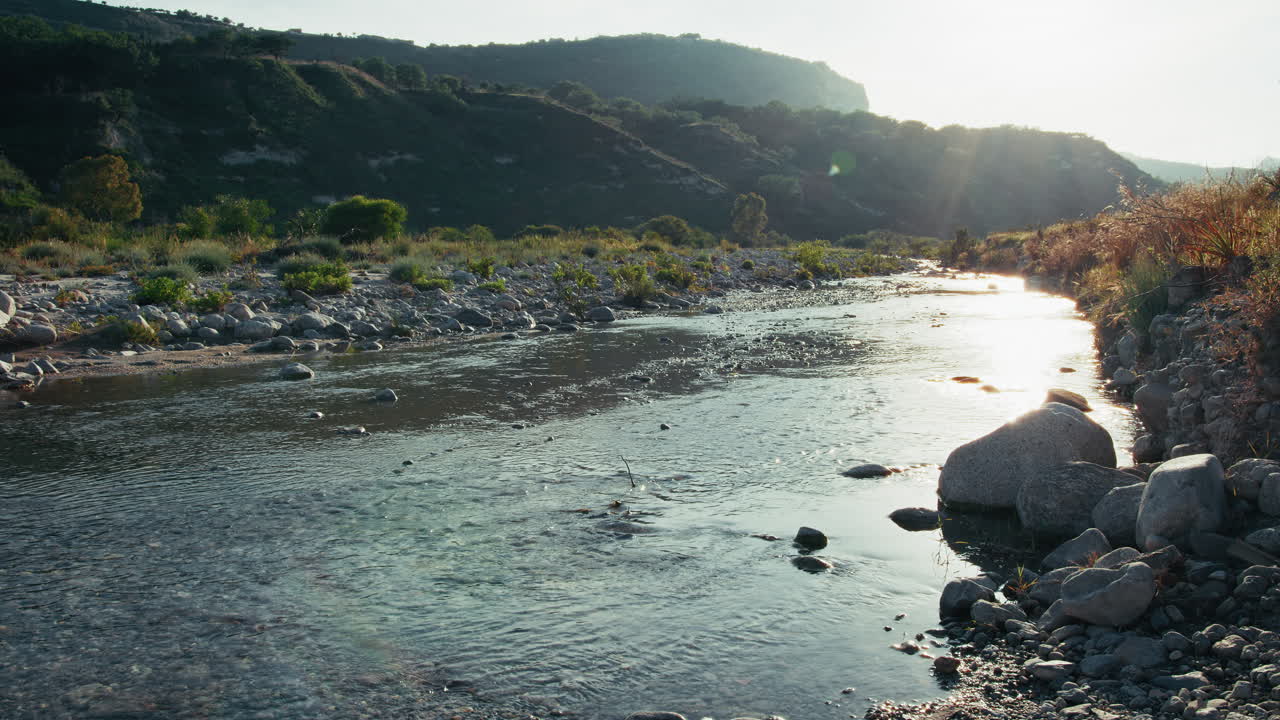 River With Water Flowing Slowly Towards Valley In Calabria, Italy
