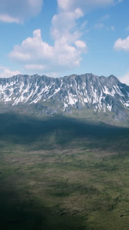 majestic mountains with snow-capped peaks and green valley