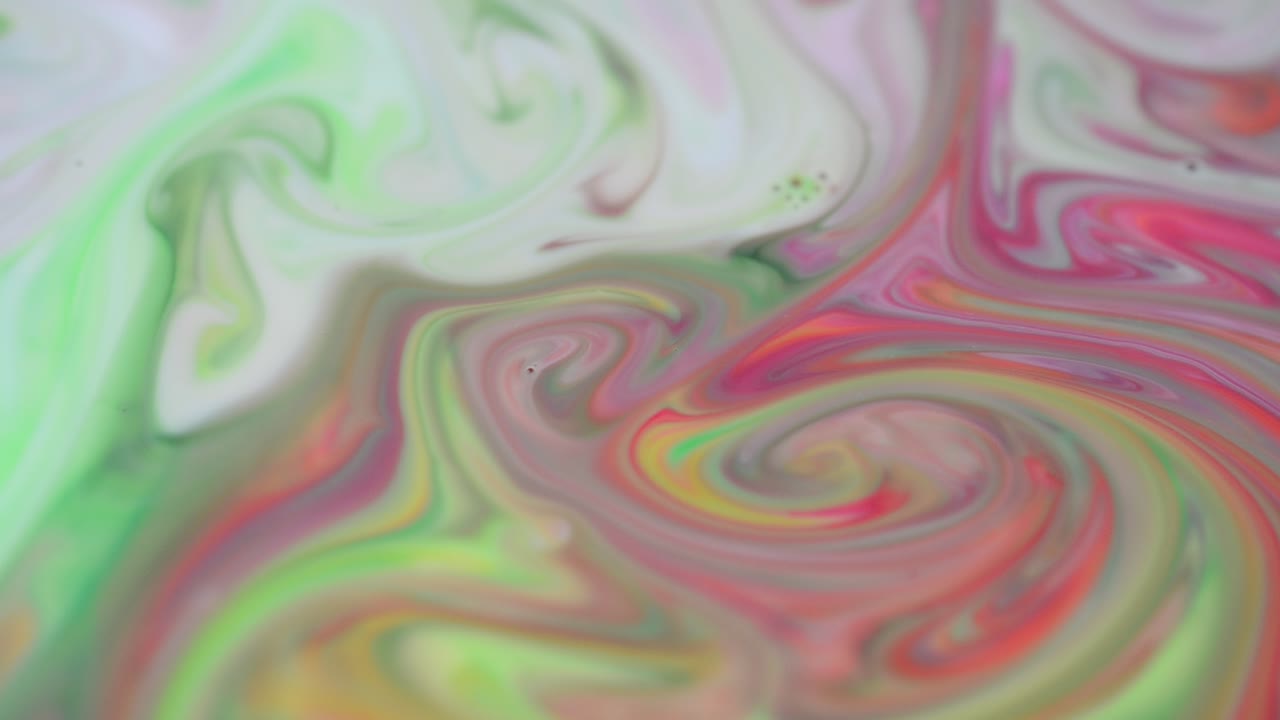Mezcla de pinturas. Gotas de pintura en movimiento